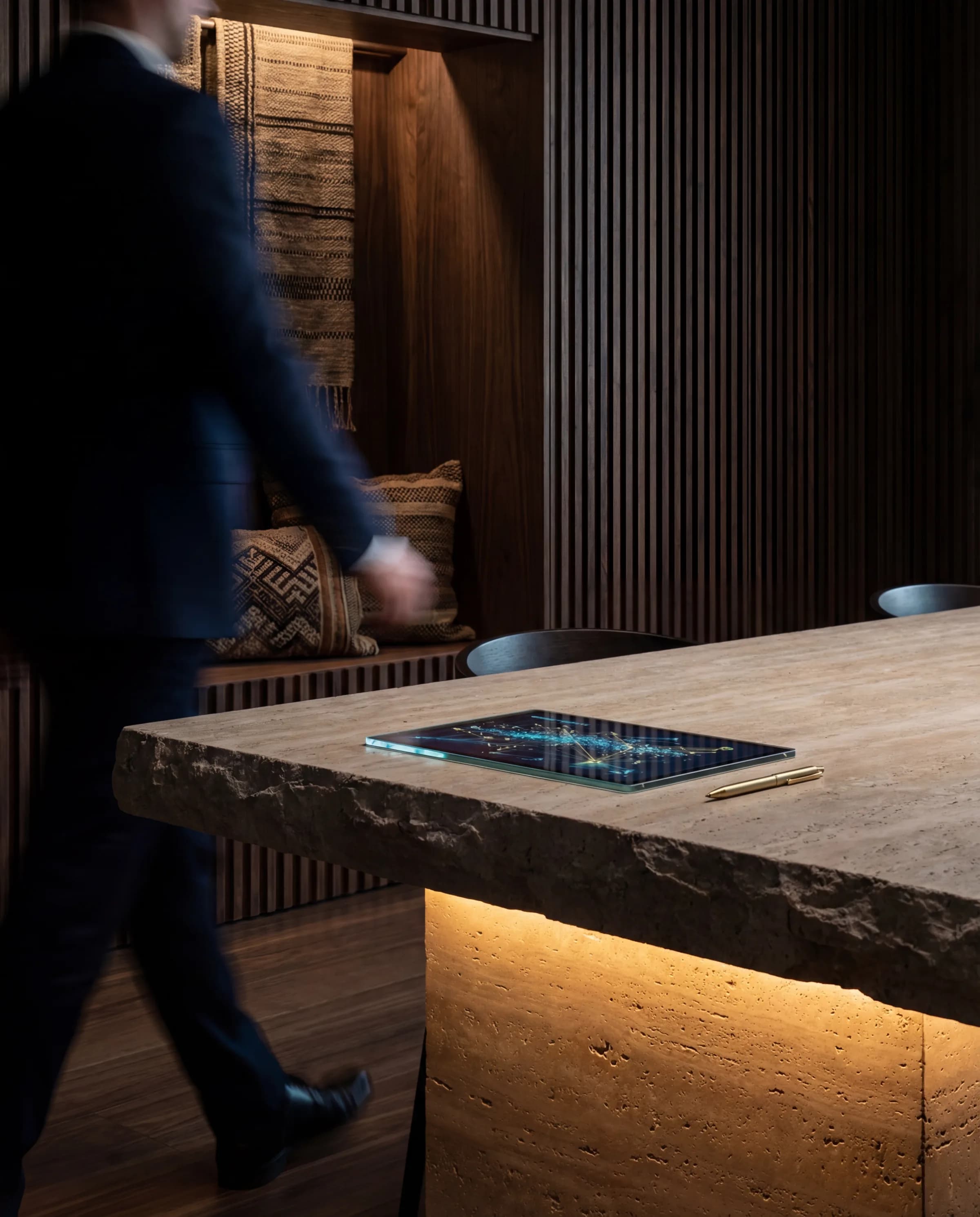 Quiet executive office framed by fluted dark-wood walls